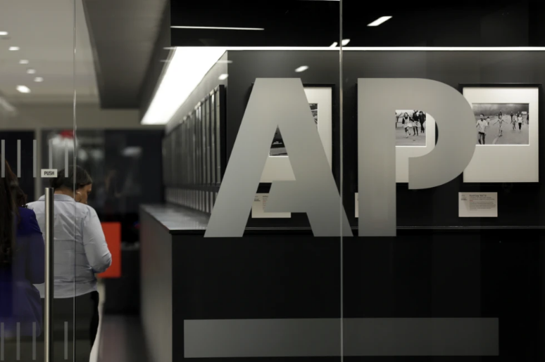 Snapshot of Associated Press photographs on display at AP headquarters. /AP