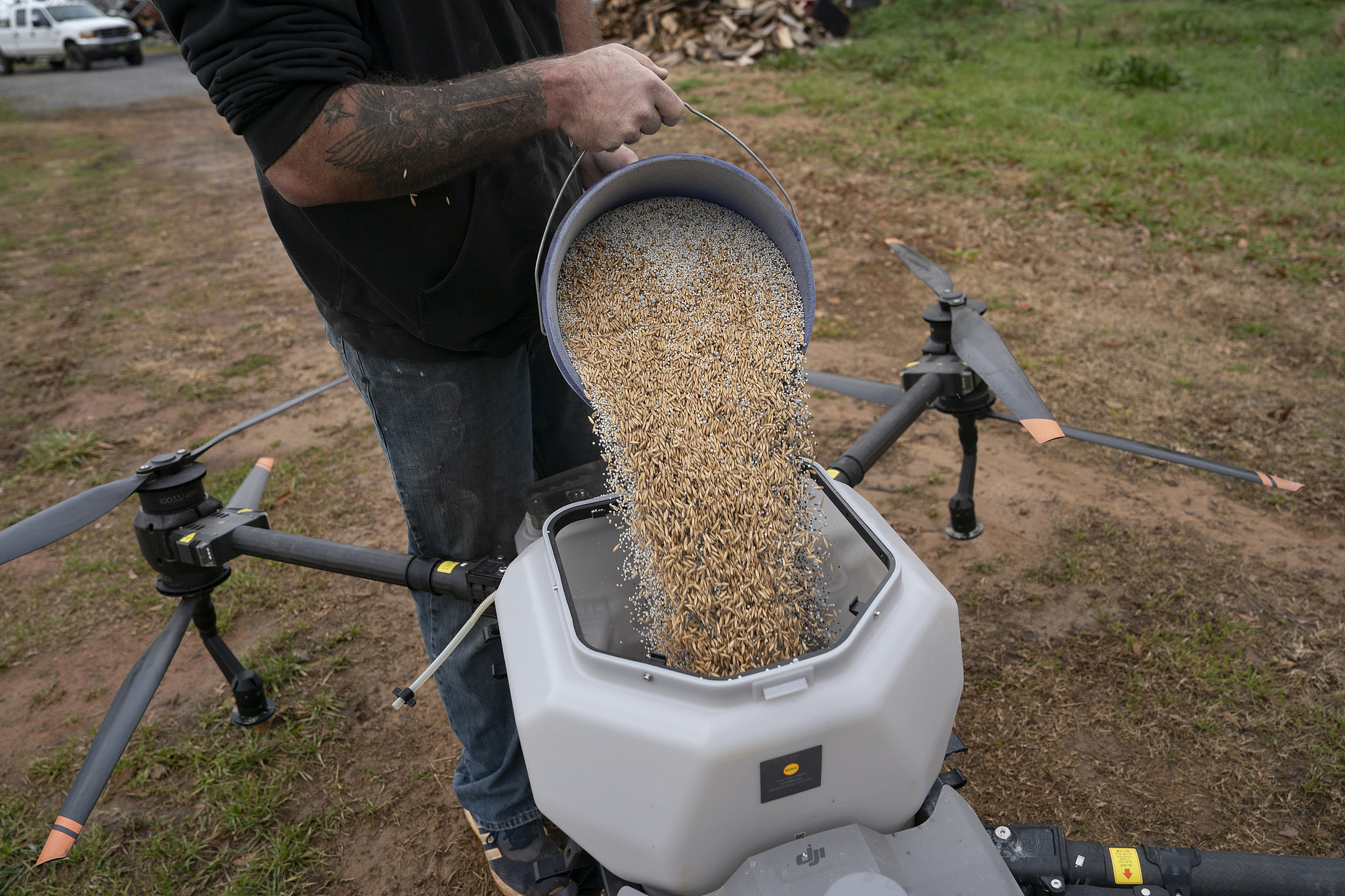 A farmer prepares a DJI drone to put crop cover on the farm in Hickory, North Carolina, U.S., December 17, 2024. /VCG