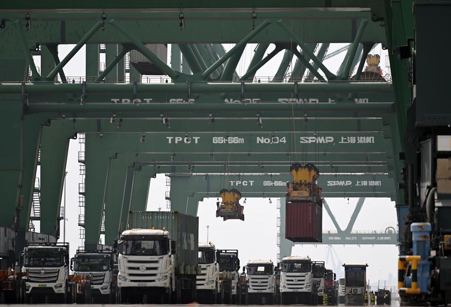 Trucks carrying containers are pictured at a container terminal of Tianjin Port in north China's Tianjin, April 8, 2025. /Xinhua