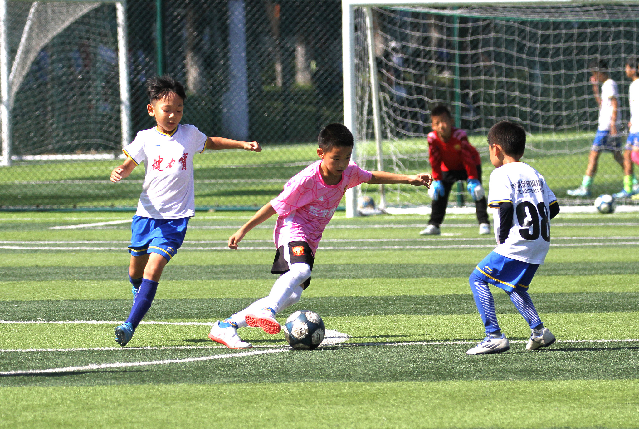 Children play football in Shenyang, northeast China's Shenyang Province, September 8, 2024. /VCG